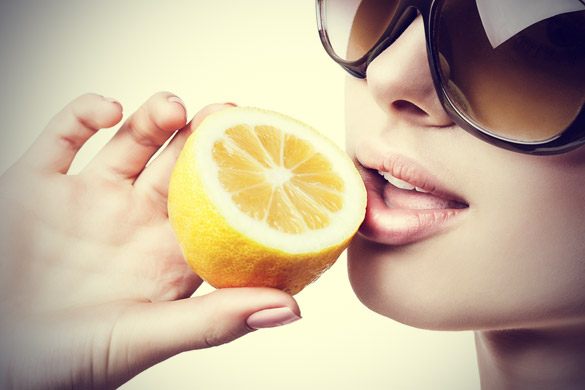 Woman-With-Sunglasses-Eating-Lemon (1)