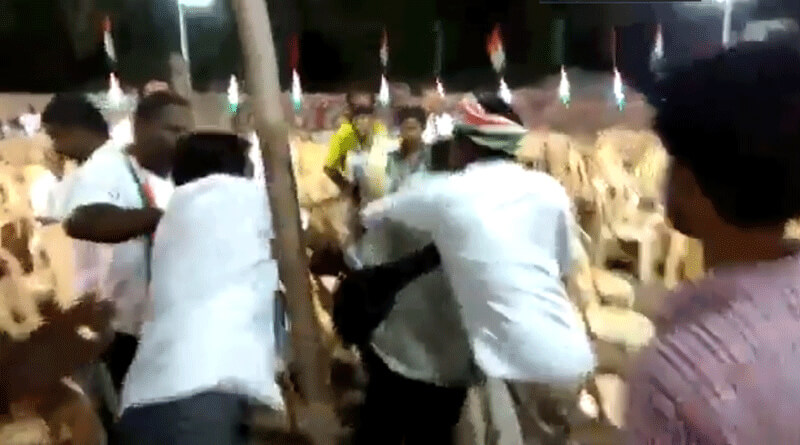 Congress workers beat up journalist for taking photos of empty chairs.