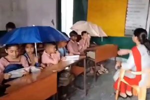 Students forced to study under umbrellas due to leaking roof in Uttar Pradesh Baghpat school