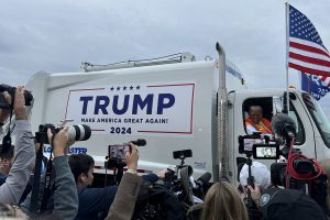 Donald Trump drives garbage truck before election