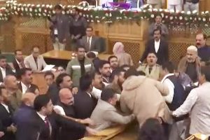 Chaos in J&K Assembly as Engineer Rashid's brother shows Article 370 banner