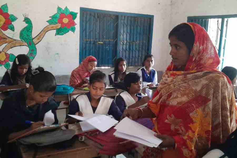 Invigilance by Self help group members during school exam in Murshidabad