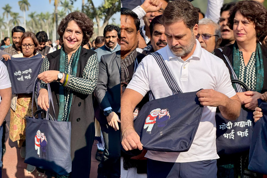 Priyanka Gandhi carries Modi-Adani bag to Parliament