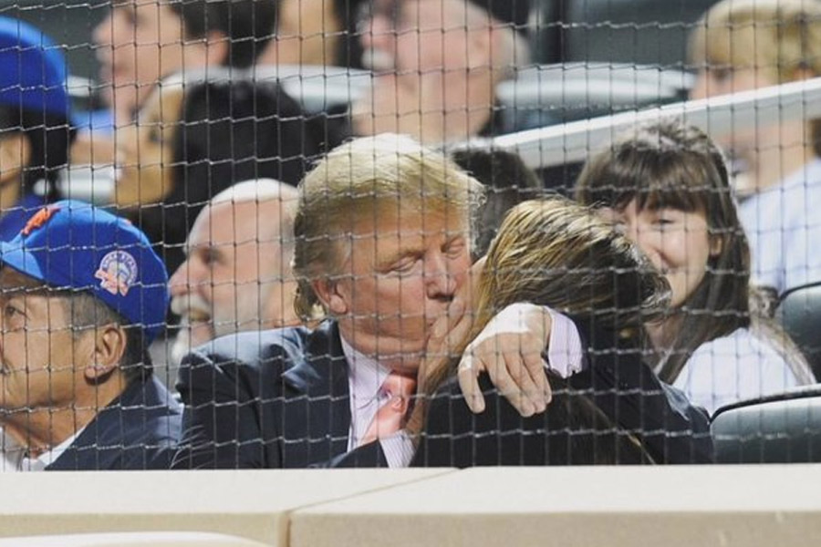 Donald Trump kisses wife in Basketball stadium