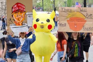 Pikachu steals the thunder at 'Hands Off!' protests against Donald Trump